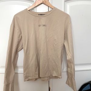 Zara - “Say it Simple” - long sleeve shirt with quote - button sleeve - beige